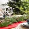 Glitzhome® 9ft Christmas Greenery PE Cedar Garland with Red Berries